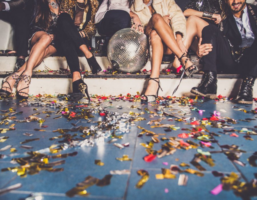 Multi-ethnic group of friends celebrating in a nightclub - Clubbers having party