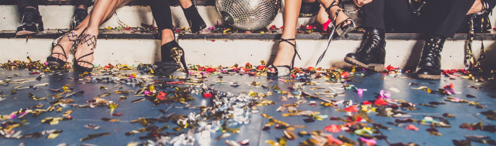 Multi-ethnic group of friends celebrating in a nightclub - Clubbers having party